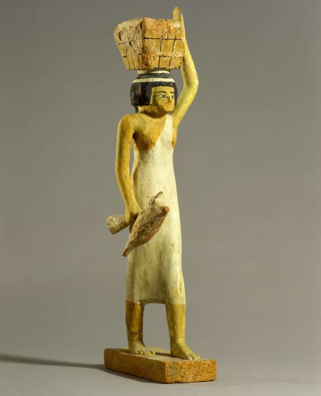 Statuette of a female offering bearer carrying a box filled with flour and holding a duck